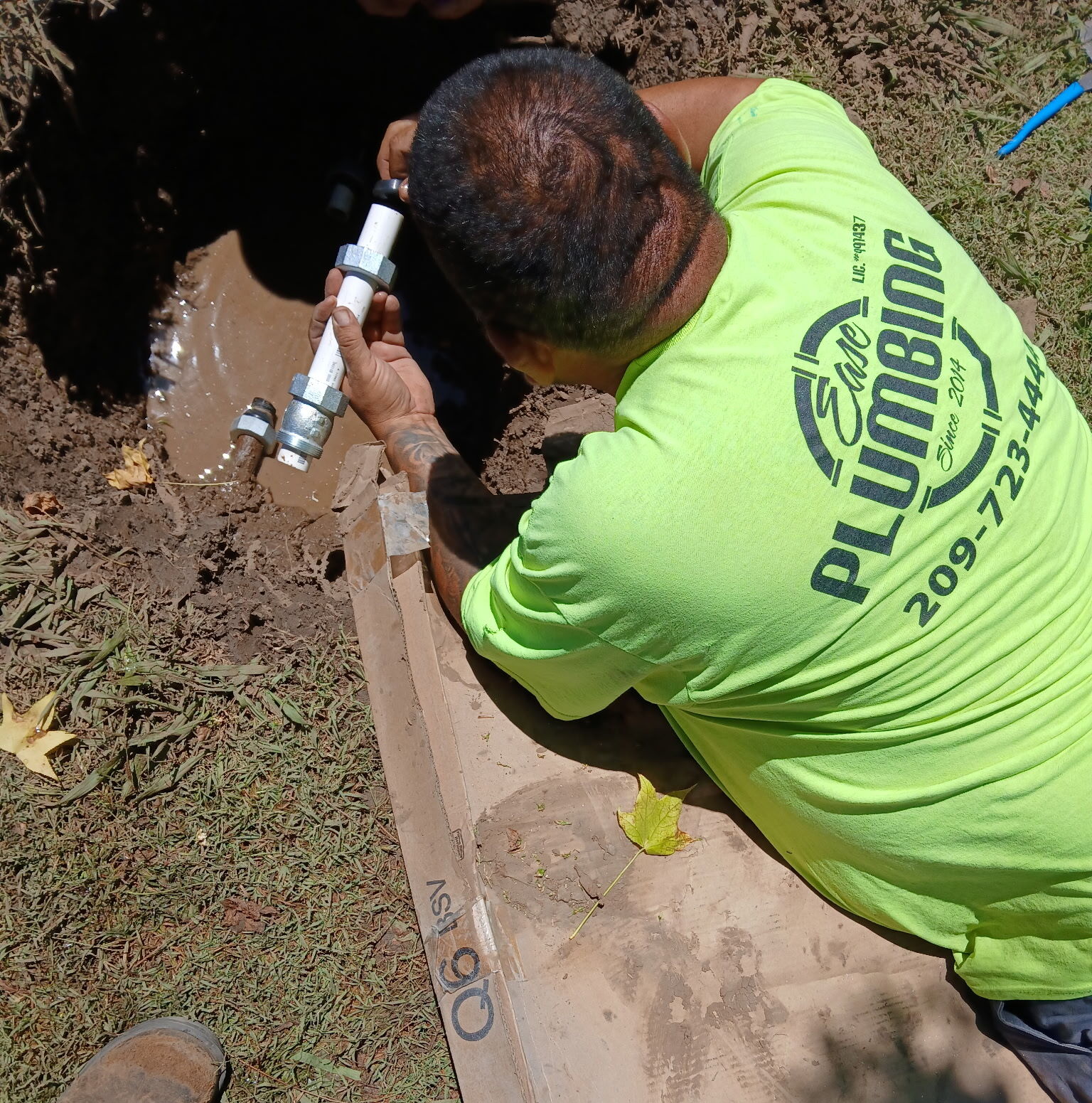 Plumber using a wrench